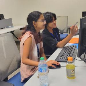 two students on a computer 
