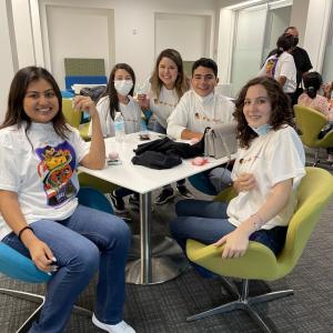 a group of students sitting at a table 