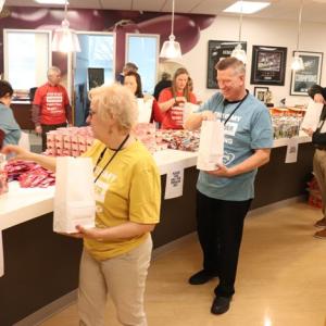 People packing snack bags