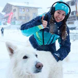 Athlete with large white dog in Olympic Village