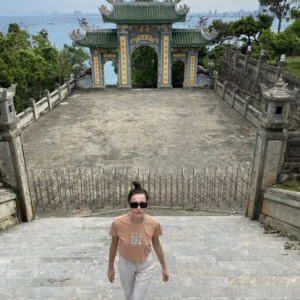 Milica in front of an Asian temple.