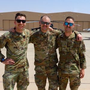 CJ (right) and his two older brothers while deployed in Saudi Arabia 