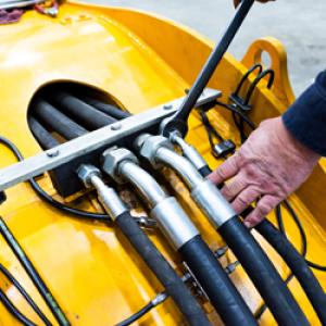 Close up of mechanical tubing attached to a machine.