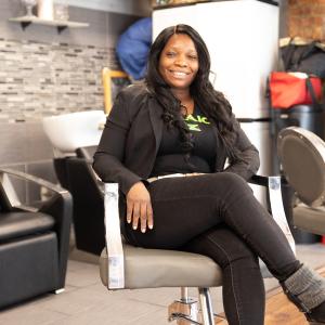  Mitzie sitting in a salon chair