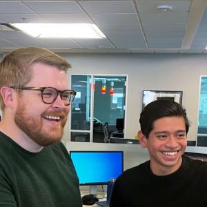 two people working together in office