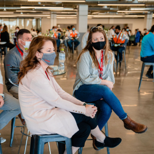 group of people sitting in a large room