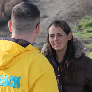 volunteer speaking to woman