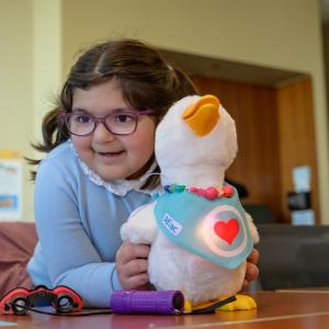 My Special Aflac Duck shown with a young Girl at Lurie Children's Hospital.