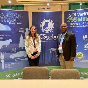 At SCS Global Services' booth at NACW 2022 - Heather Rosa, Program Manager of Energy, Industry and Agriculture and Kenneth Zame, Sales Executive for Carbon Offset Verification