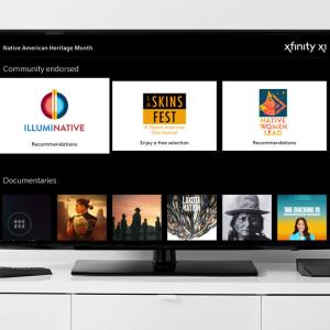 A TV on a white sideboard displaying Xfinity