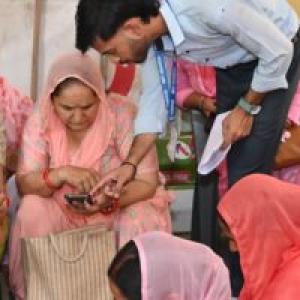 Group of Indian women looking at their phones