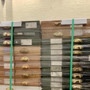 archival case of drawers shrink-wrapped and strapped