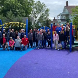 KeyBank volunteers shown in a playground that has been cleaned.