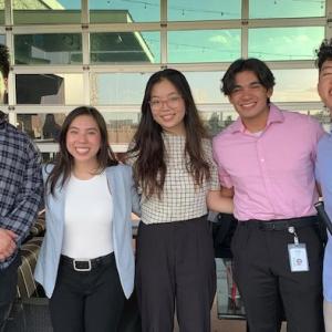 Five NRG Interns shown in an office.