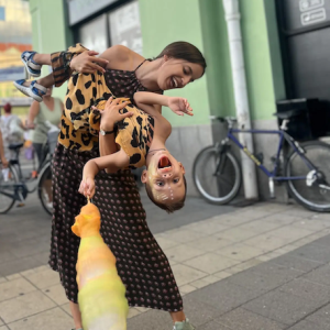 Natasa holding her daughter in her arms.