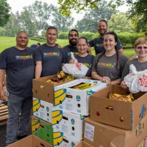 Volunteers distributing boxes of food