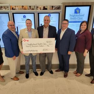 Check presentation of $20,000 from KeyBank to Neighborhood Health Care.