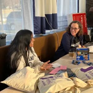 Two people working at a table together