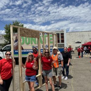 KeyBank volunteers with a completed frame.