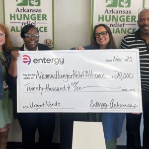 Group photo of people holding up check for Arkansa's Hunger Relief Alliance