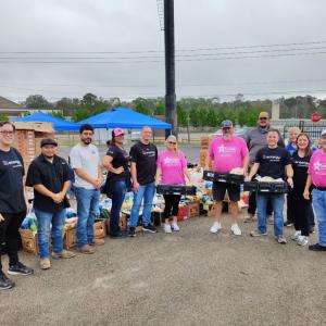 Entergy volunteers distributing food