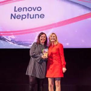 Two people posed with an award. "Lenovo Neptune" displayed behind them.