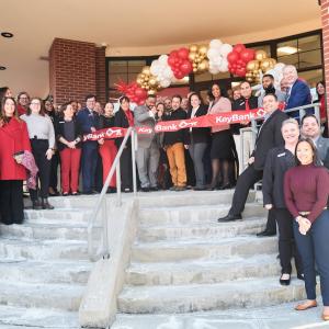 KeyBank Branch Manager Jeffrey Almanzar (center with scissors) cuts the ribbon on the bank’s newest branch at 1 Main Street Port Chester, NY at a ribbon-cutting ceremony held January 29, 2025.