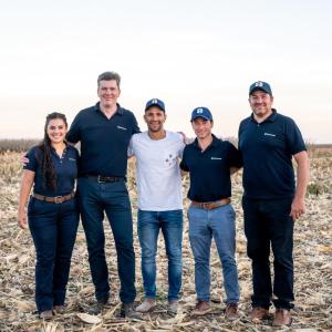 5 people standing in a field