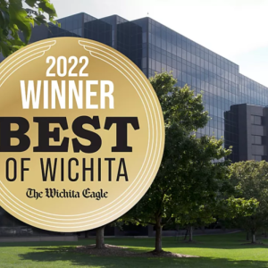 award with building and trees in background