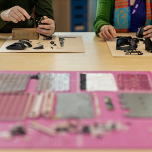 two people working on an electronics project