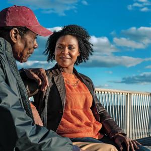 Two people sat on a bench