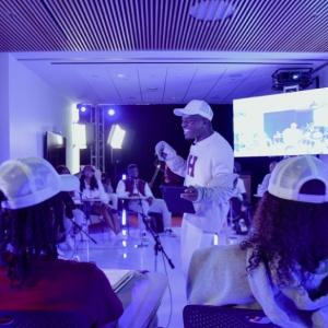 Group of people watching No Label Academy presentation