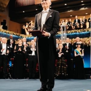 Dr. Moungi Bawendi shown holding the Nobel Prize. 