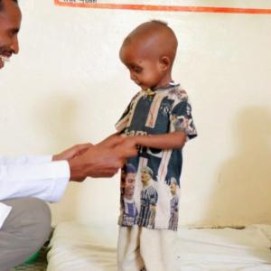 Nuredin, a staff member at the Action Against Hunger-supported health clinic, takes joy in helping Gebremedihin’s son recover.