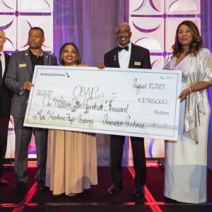 people holding display check