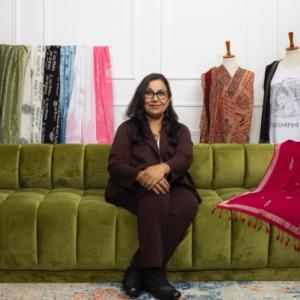 Jyoti Jaiswal sat on a green couch