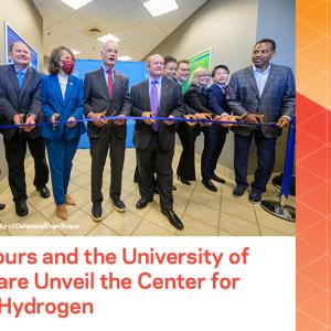 Group of people at a ribbon cutting 