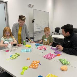 adults and children participating in science experiments and activities