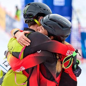 Two athletes hugging