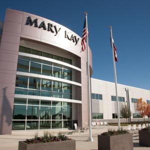 A large office building with "Mary Kay" sign.