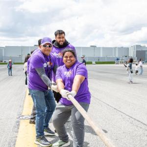 Volunteers play tug-of-war