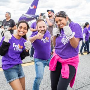 Volunteers in FedEx Cares shirts