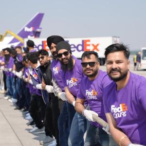 Volunteers play tug-of-war