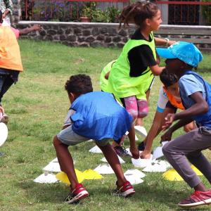 Young children playing sport outdoors