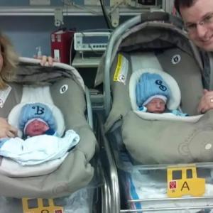Family with infants in car seats.