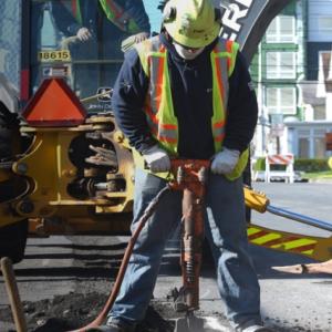 PSEG worker using a jackhammer.