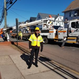 Photo of PSEG employee in protective gear in the field.