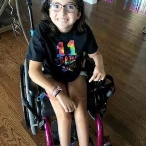 Photo of Sophia smiling.