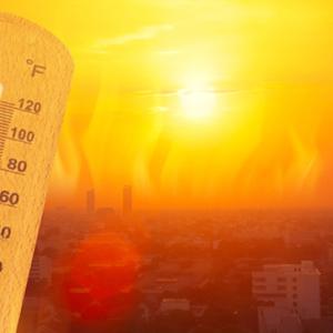 Thermometer shown against a blazing red sun.