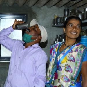 Man drinking water from Aquahome